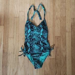 Cut out one piece teal bathing suit.